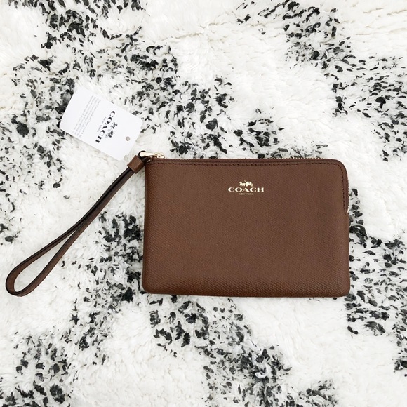 Coach Handbags - 🆕COACH Corner Zip Wristlet in Saddle / Brown